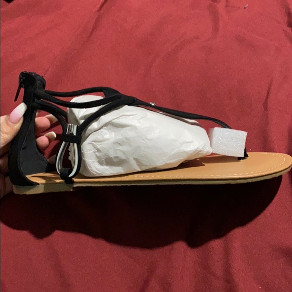 Black thong sandals.